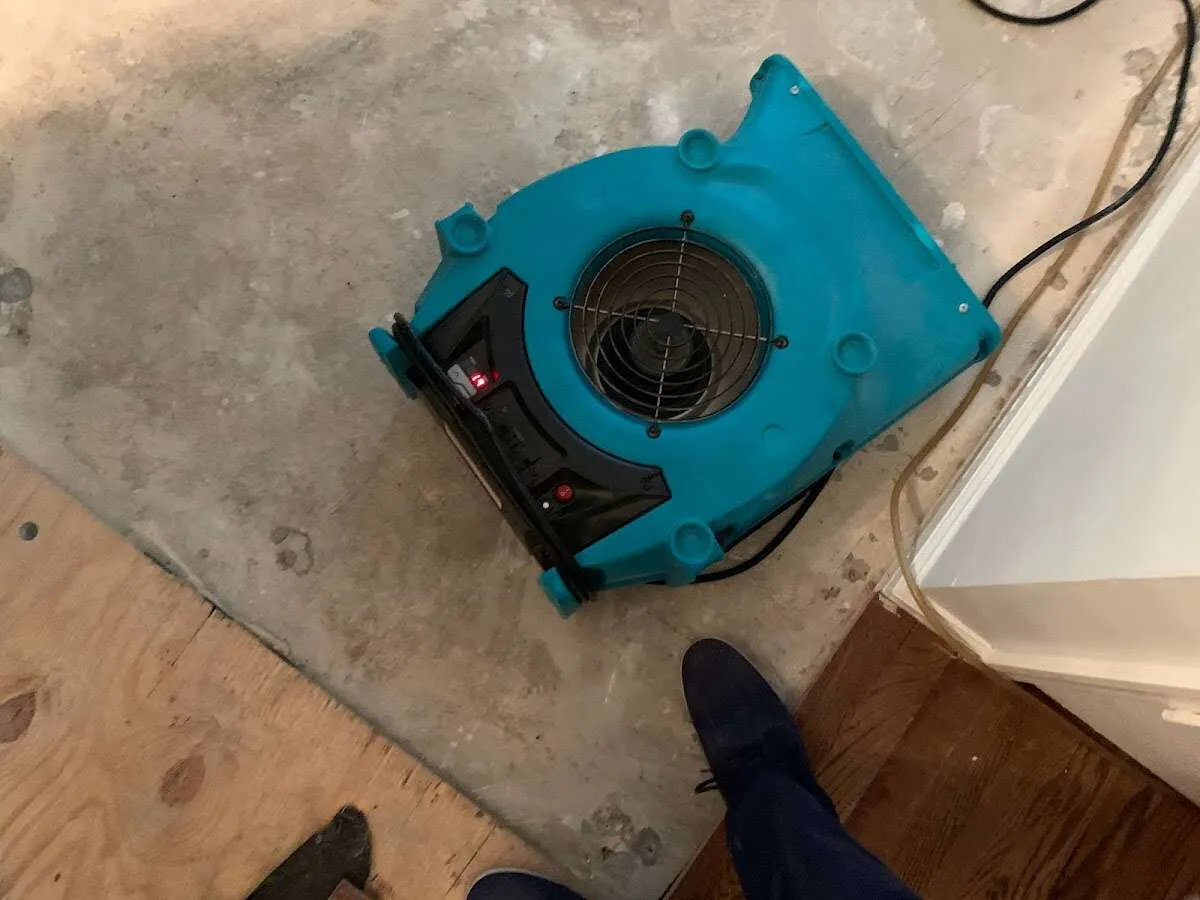 Air mover drying subfloor during Commercial Water Damage Restoration in Kennesaw